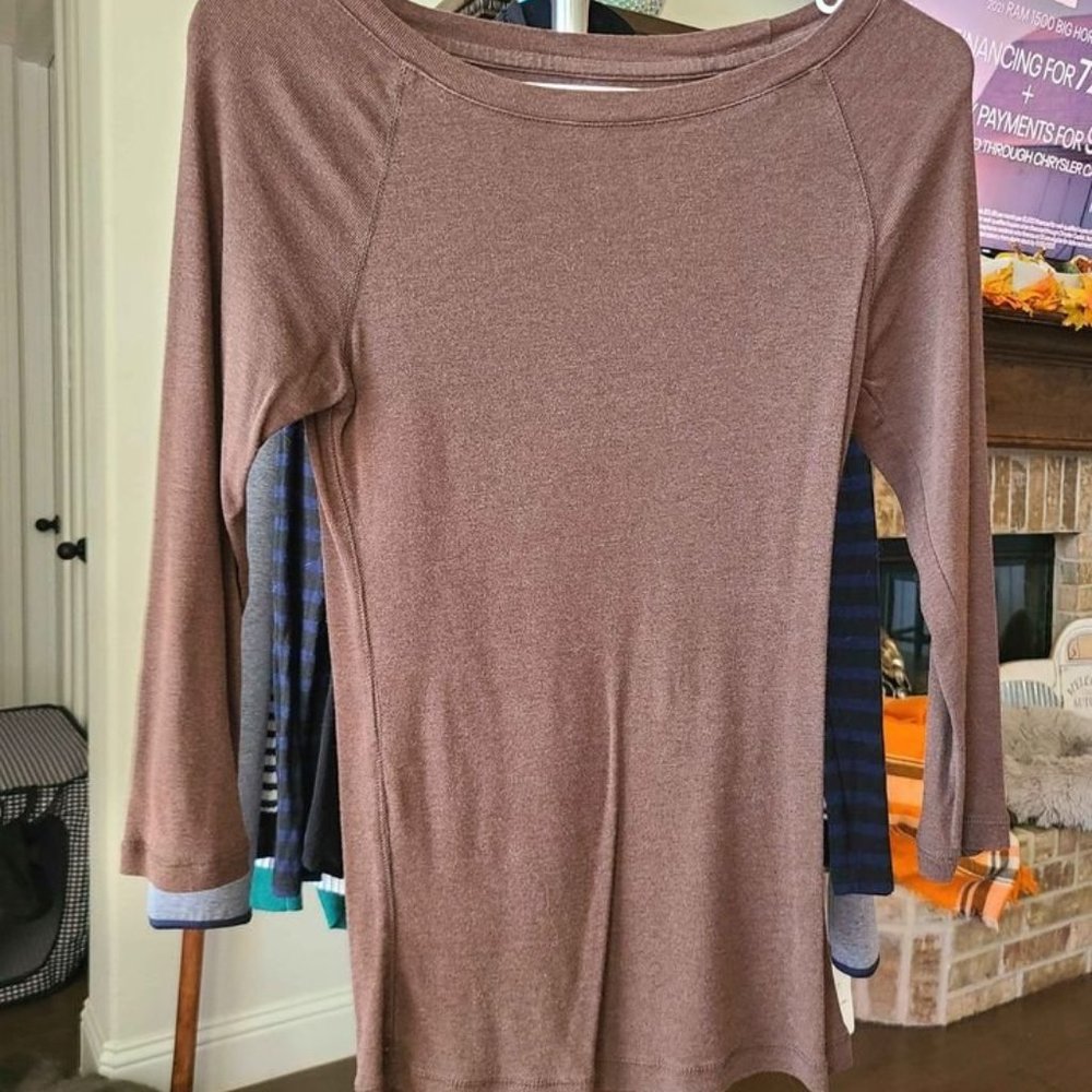 Smoke free home. In great condition. Feels silky. Sleeveless. Limited run throug